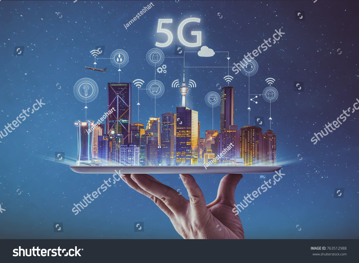 Waiter hand holding an empty digital tablet with smart city and 5G network wireless systems and internet of things . #763512988