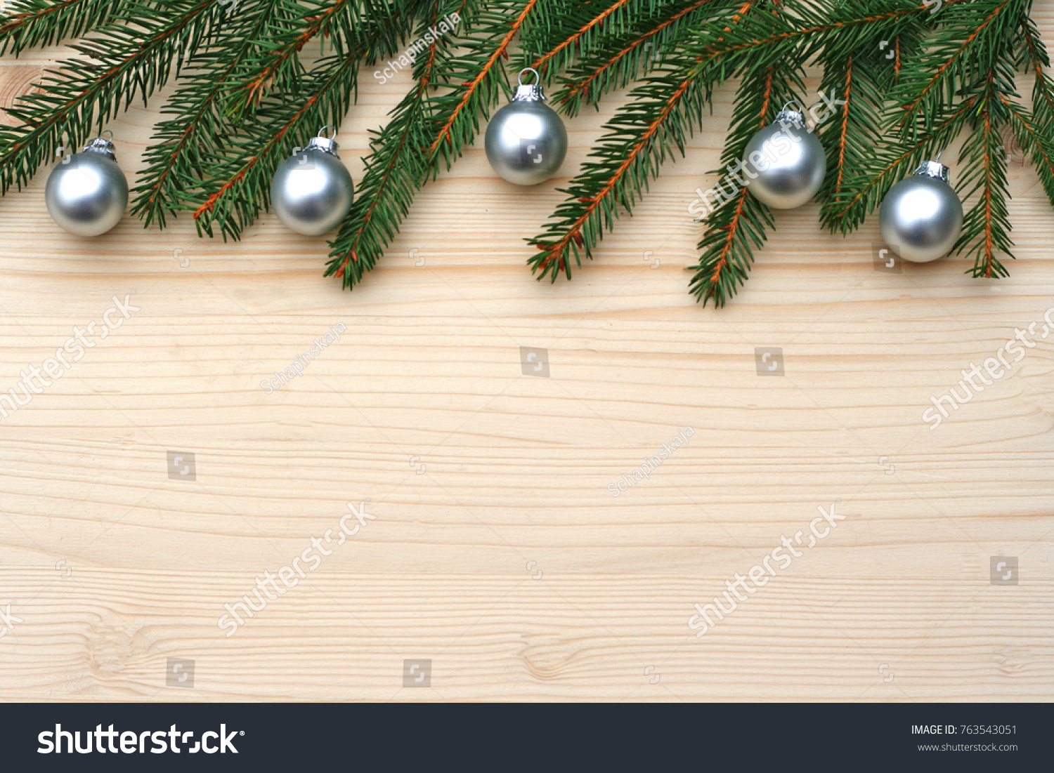 vintage Christmas background with fir branches and silver balls on wood #763543051