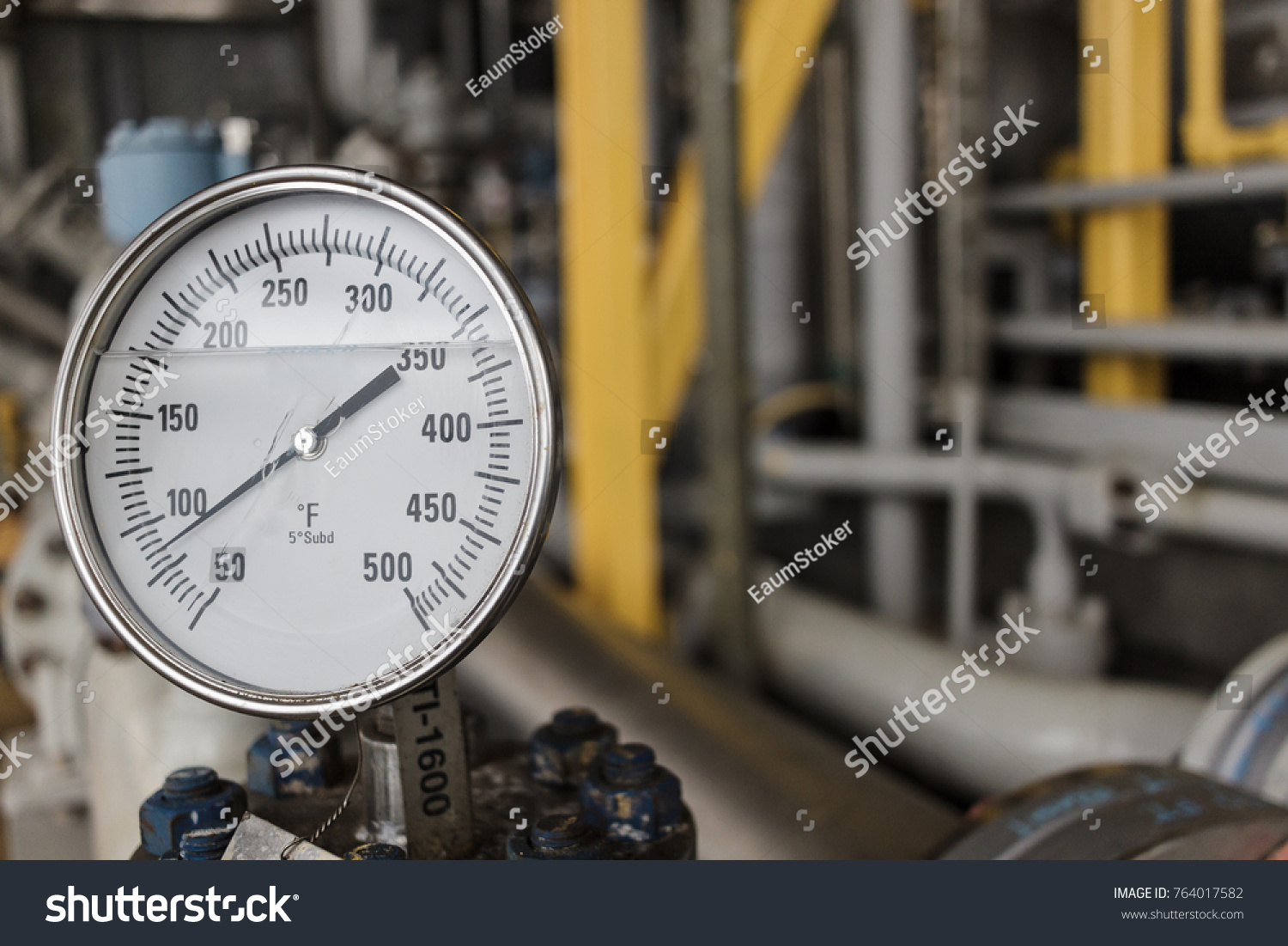 Thermometer, Temperature gauge or temperature indicator reading eighty five Fahrenheit (°F) in offshore oil and gas refinery process operation industry. #764017582