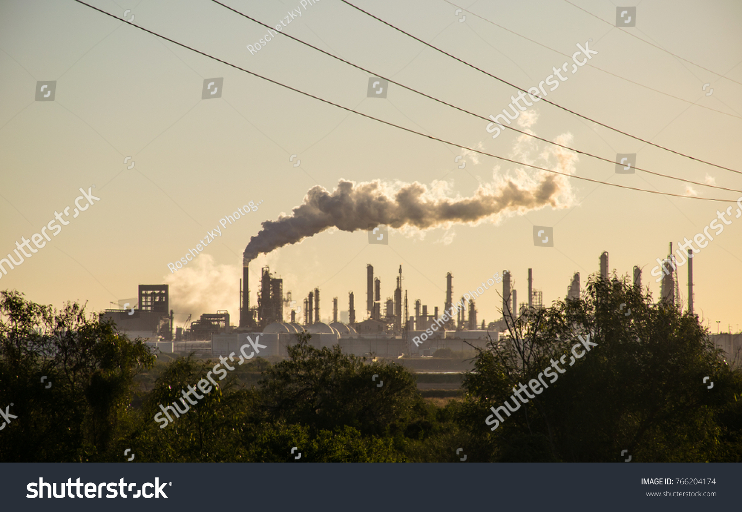 Oil refineries polluting carbon and cancer causing smoke stacks climate change and power plants in Corpus Christi , Texas a massive large refinery #766204174