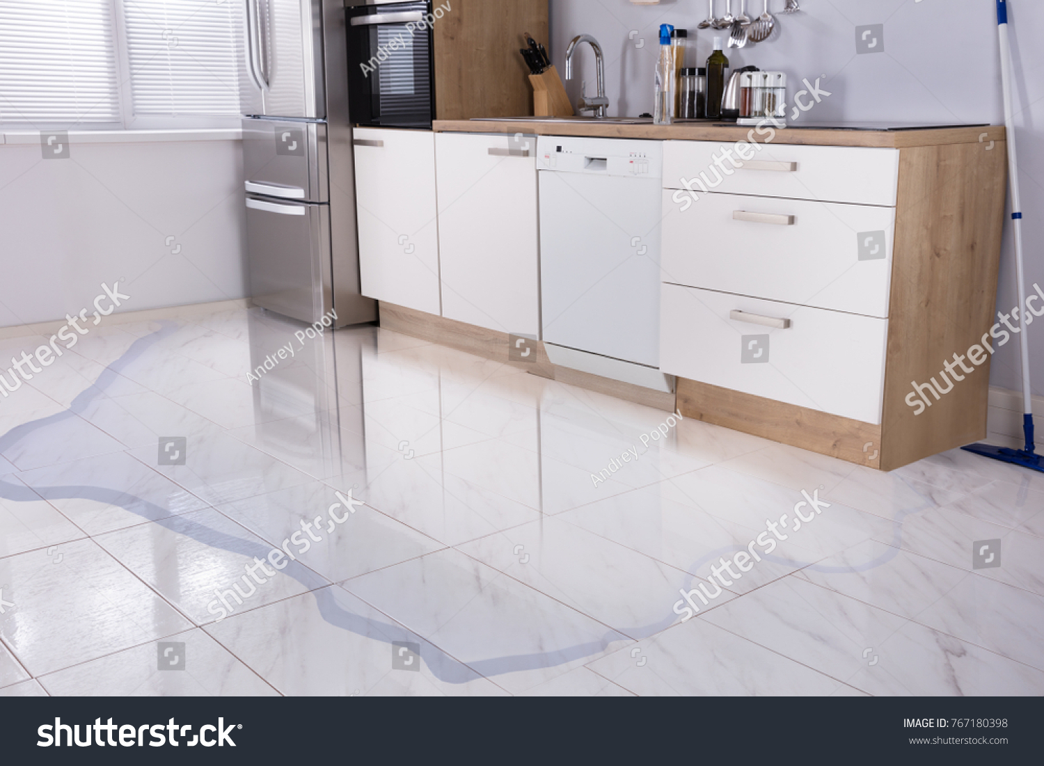 Close-up Photo Of Flooded Floor In Kitchen From Water Leak #767180398