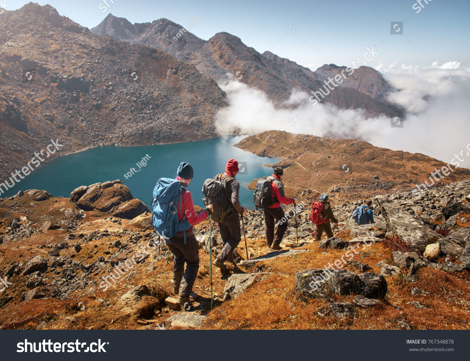 Group of tourists with backpacks descends down mountain trail to lake during a hike in the national park Lantang, Nepal.
Beautiful inspirational landscape, trekking and activity. #767348878