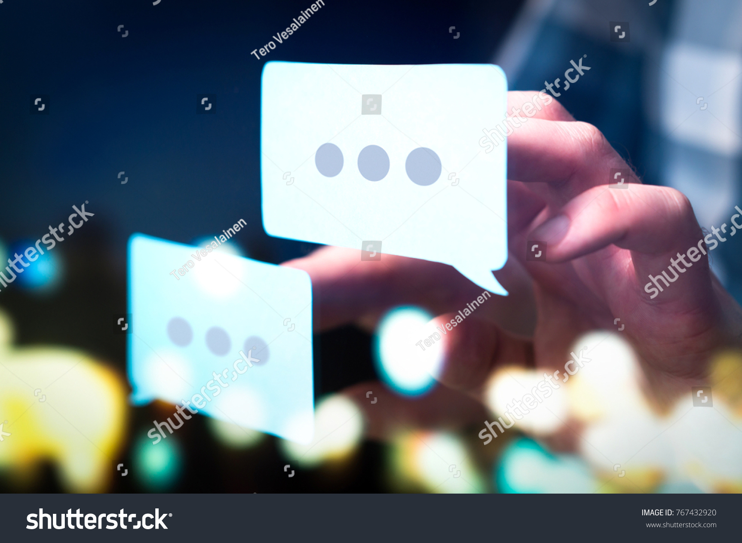 Communication, dialog, conversation on an online forum and internet chatting concept. Business man or social media consultant holding speech bubbles in futuristic modern abstract space. #767432920