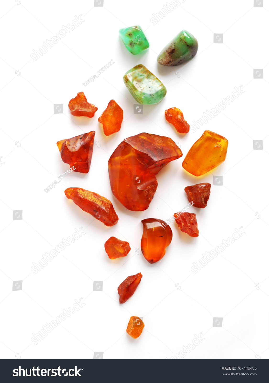 Composition of natural stones of amber and chrysoprase. Amber stone isolated on white background. Natural raw amber. Jewelery from amber. #767440480