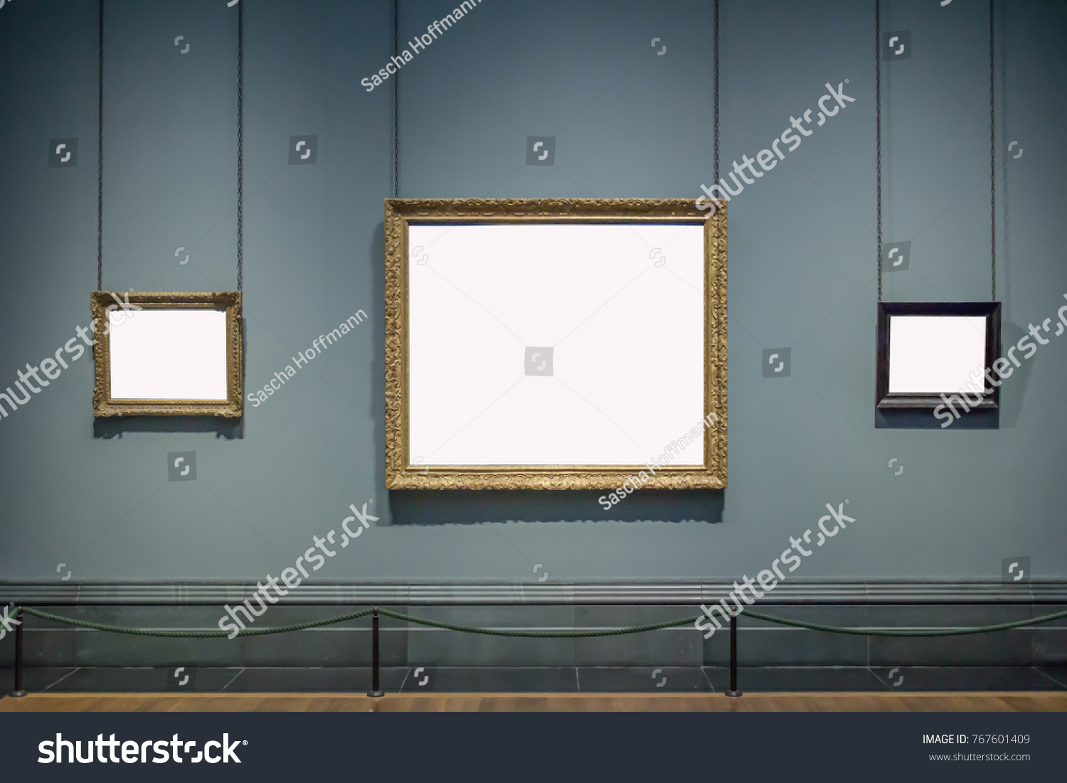 3 blank hanging individual frames in an art gallery museum exhibition template #767601409