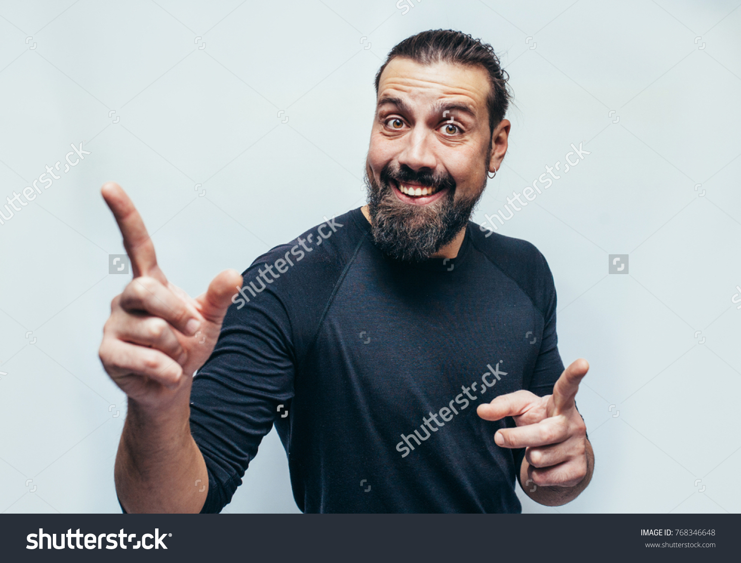 Stylish bearded hipster man with appealing dark eyes smiling into camera. Hipster man with beard  having cheerful look. Positive emotions.Crazy emotions. joy. The idea came. The emotional portrait.  #768346648