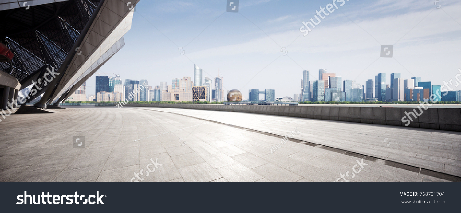empty marble floor and cityscape of hangzhou qianjiang new city in blue cloud sky #768701704
