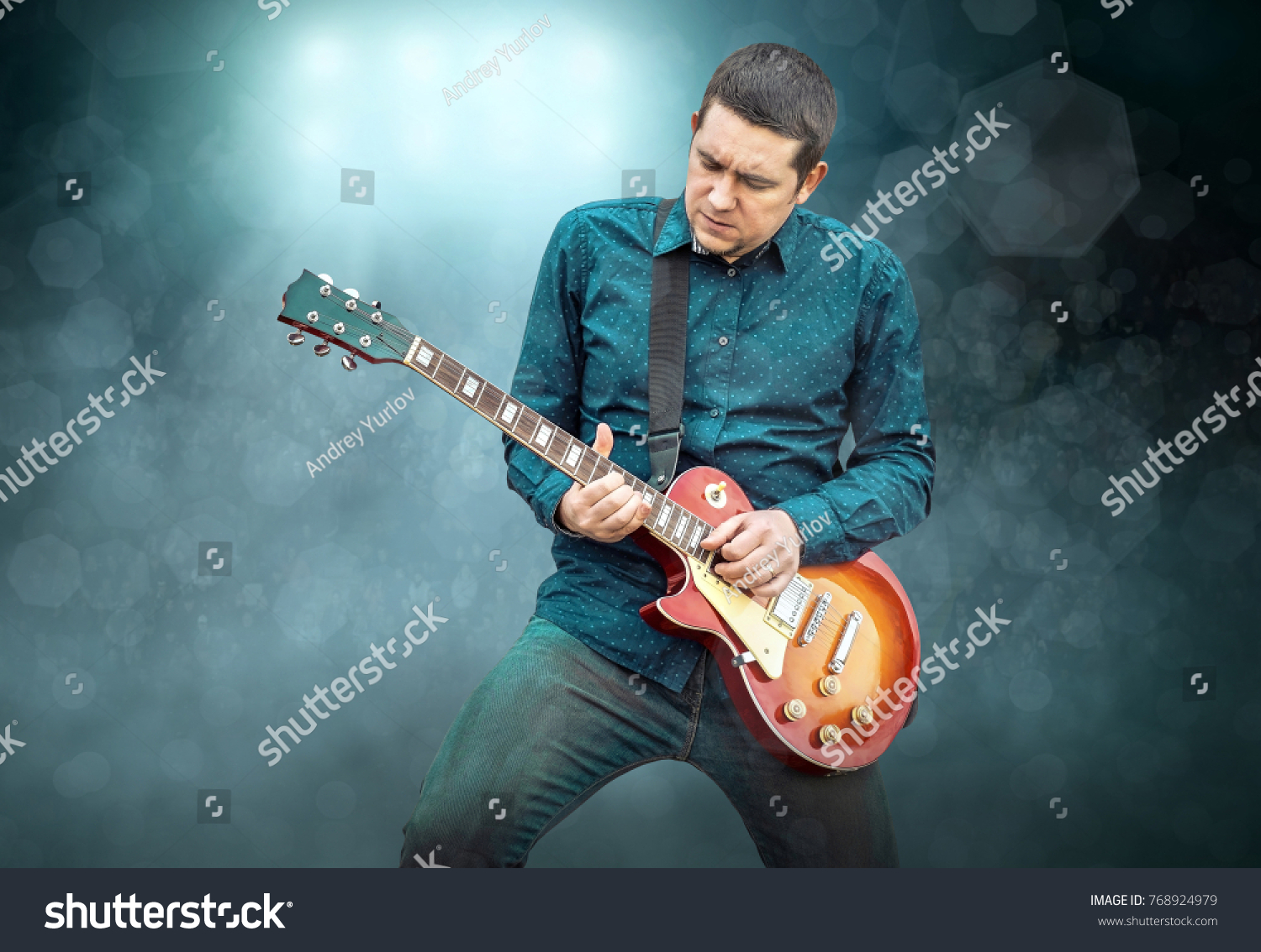 Artist Guitarist hands play on electricity guitar under light, Practicing in playing . Song entertainment and music instrument. #768924979