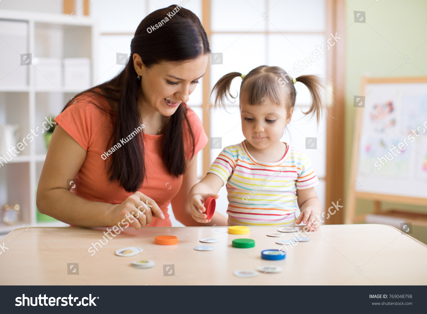 Kid plays logical game at the lesson of a psychologist #769048798