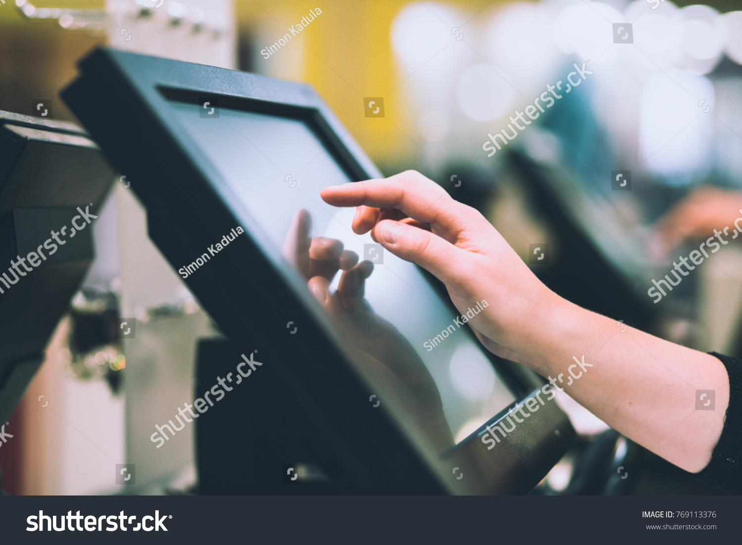Young woman hand doing process payment on a touchscreen cash register, finance concept (color toned image) #769113376