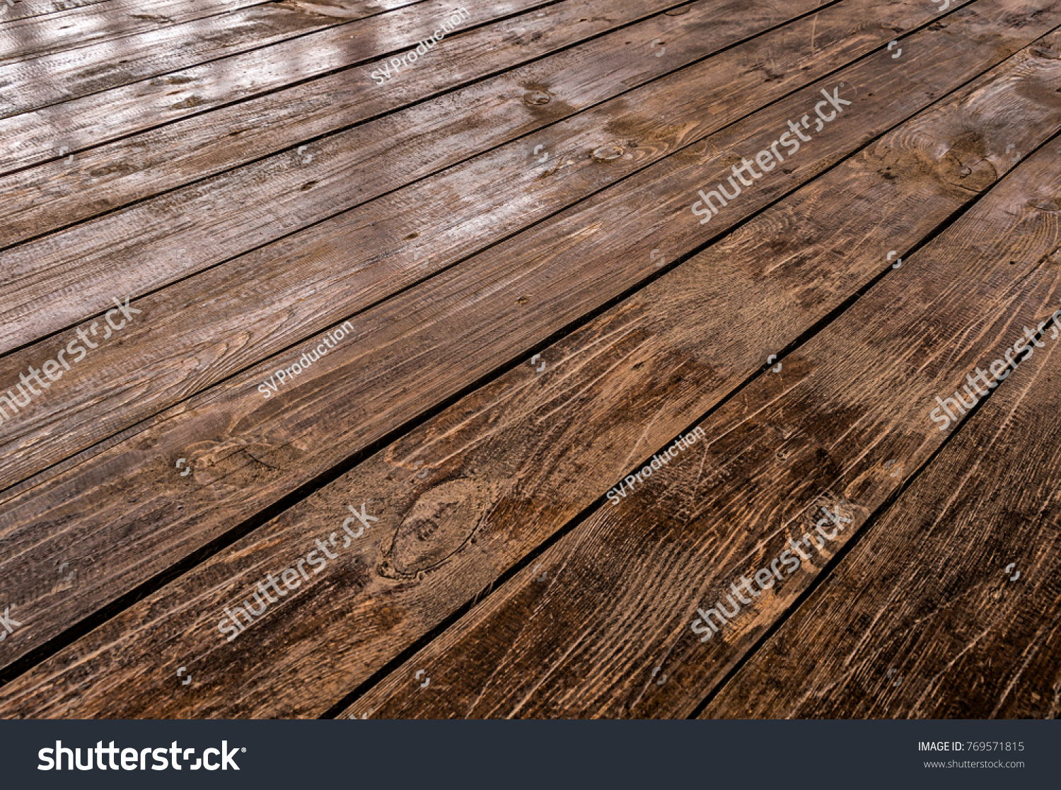 Brown on the veranda floorboards close up as background. #769571815