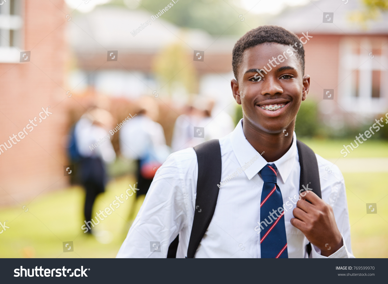 Portrait Of Male Teenage Student In Uniform Outside Buildings #769599970