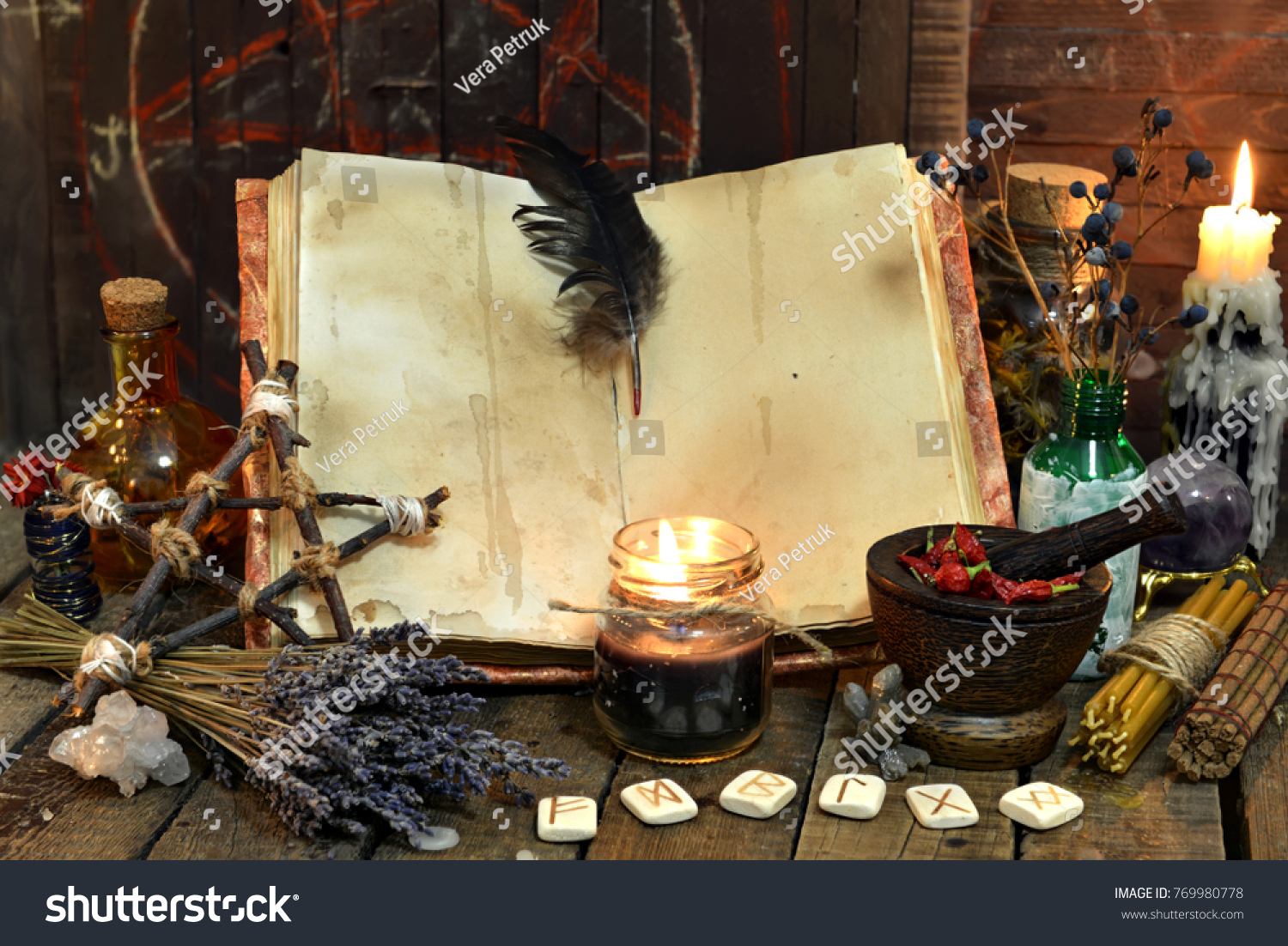 Old witch book with empty pages, lavender flowers, pentagram and witchcraft objects. Occult, esoteric, divination and wicca concept. Mystic and vintage background  #769980778