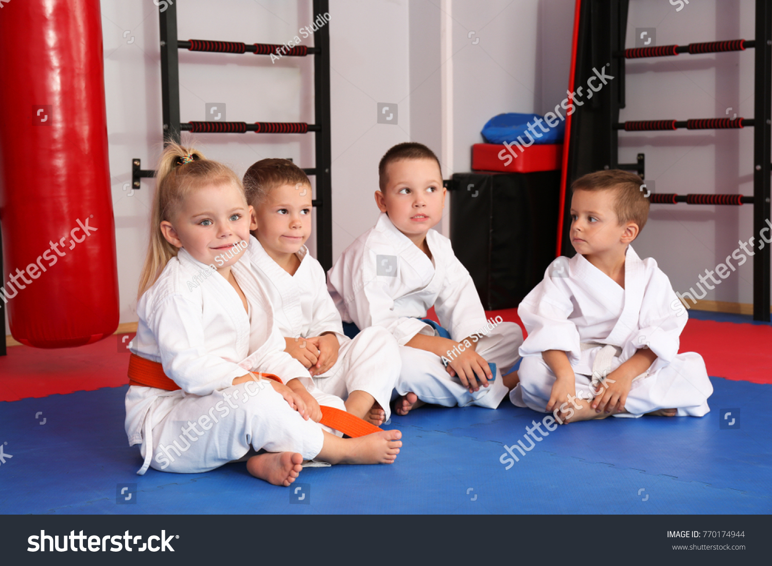 Little children wearing karategi in dojo #770174944