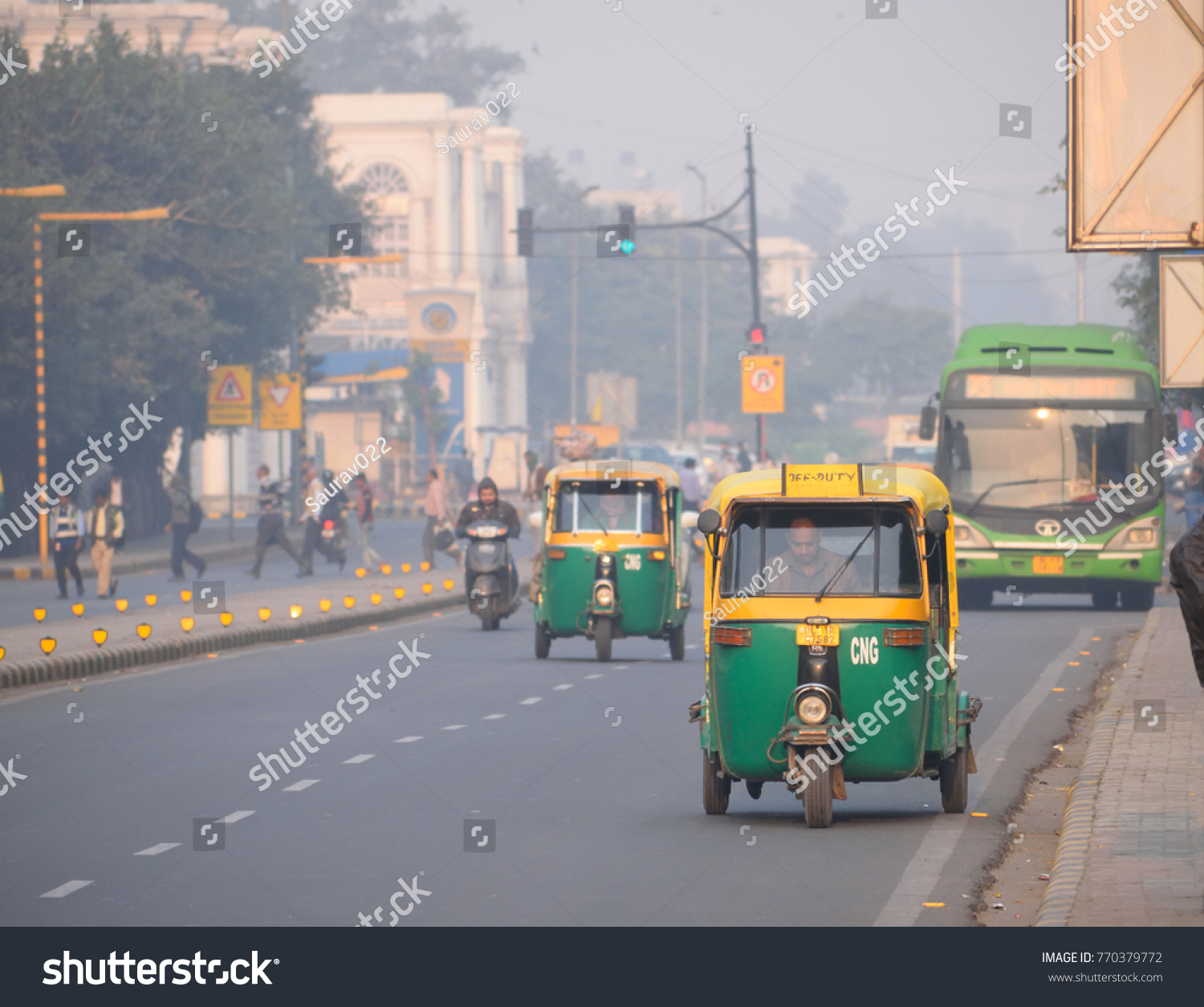 Delhi, India - November 21, 2017: Auto rickshaw traveling on the road. #770379772