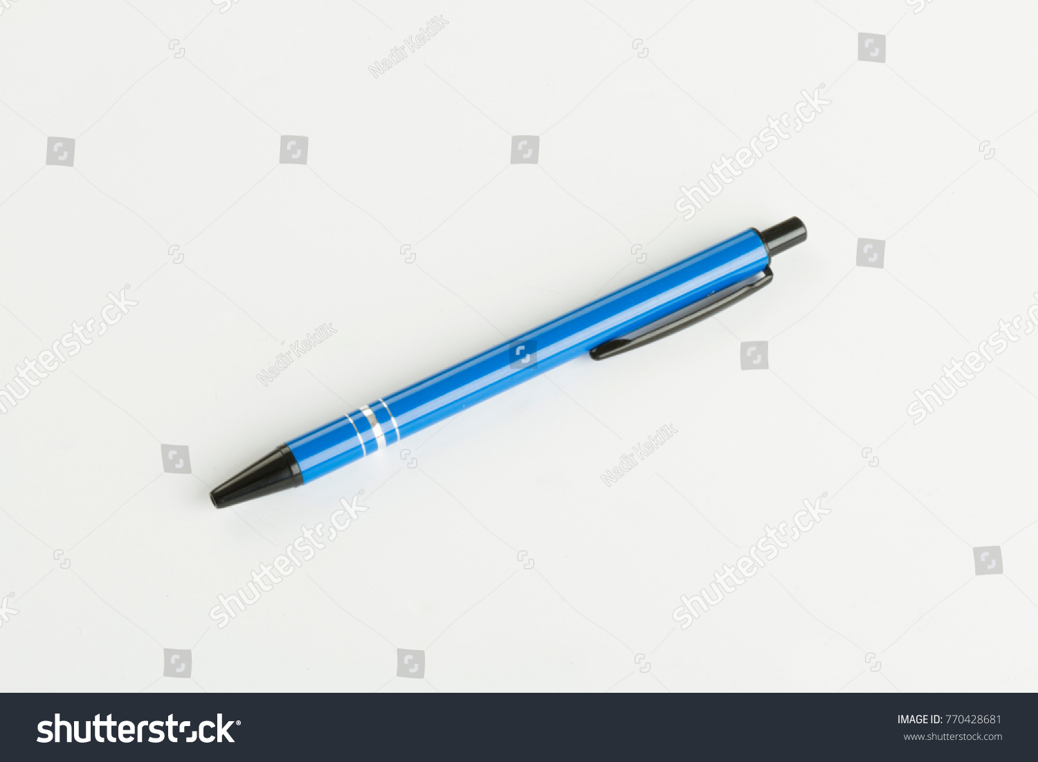 Blue and black plastic ballpoint pen isolated on white background.  The metal commonly used is steel, brass, or tungsten carbide.  #770428681