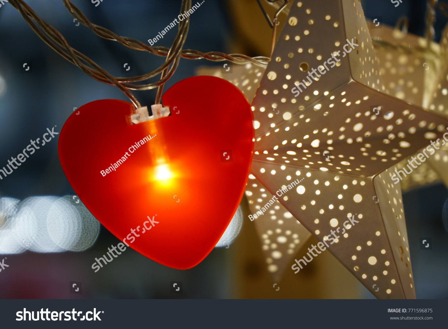 Bright red heart hanging with white star #771596875