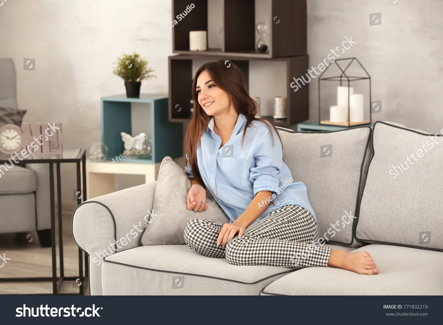 Young woman relaxing on sofa at home #771832219