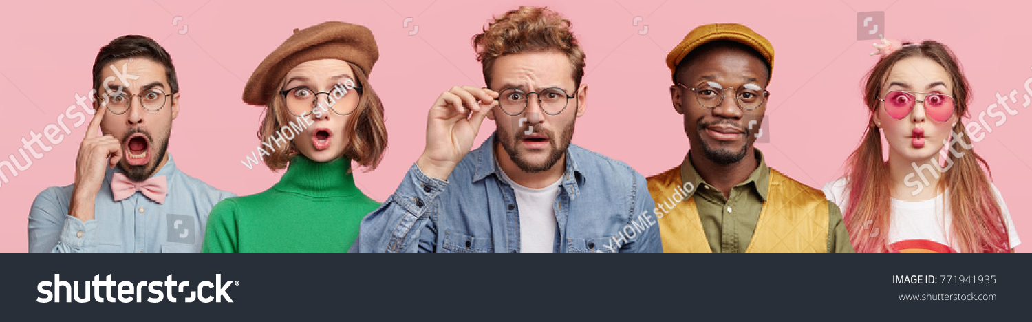 Composition of five different people wear spectacles, look with surprised expression, beig from various nations, express shock and disbelief. Women and men stand in row isolated on pink background #771941935