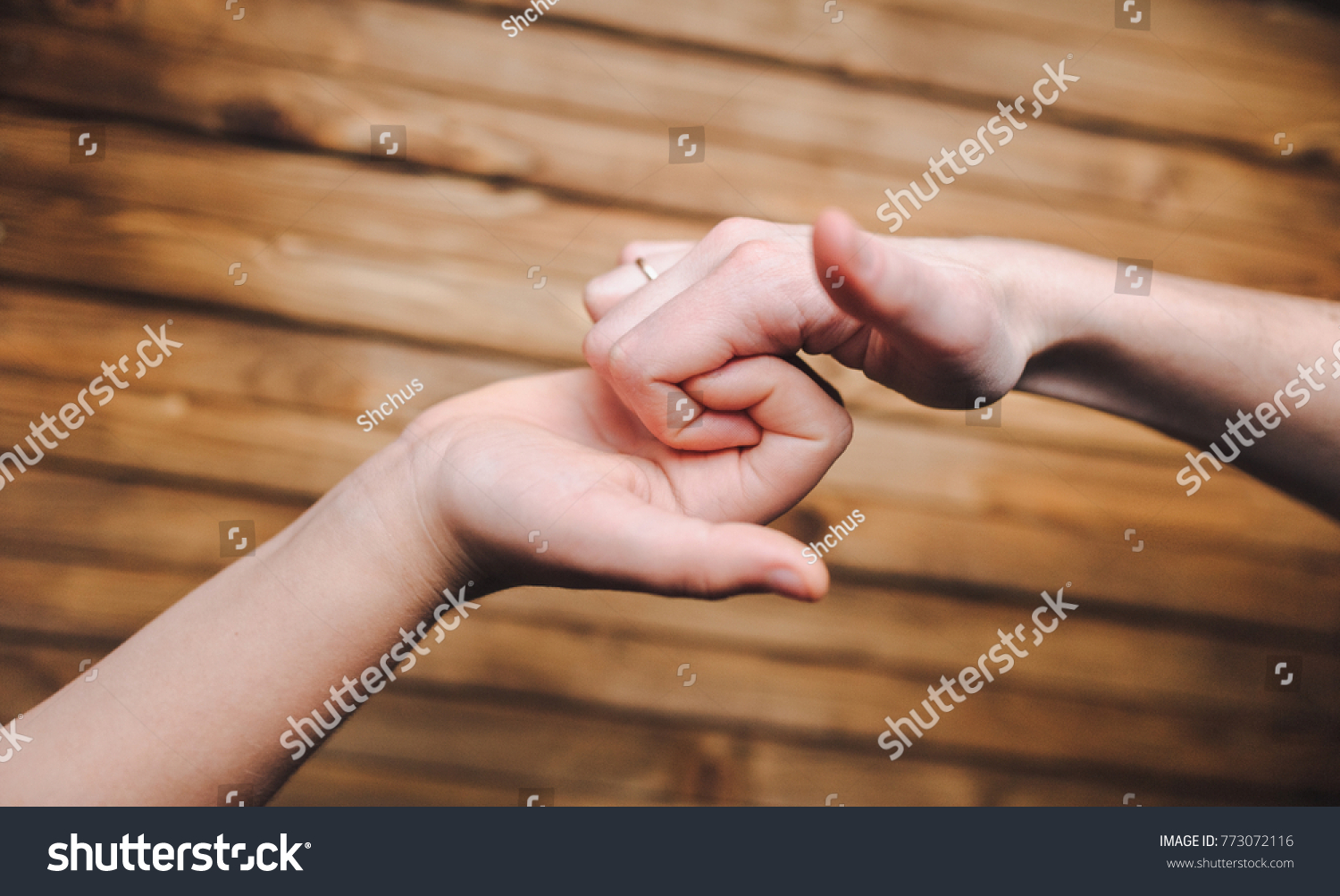 The hands of friends who greet each other at the meeting. Joke. A cheerful greeting. The game. #773072116