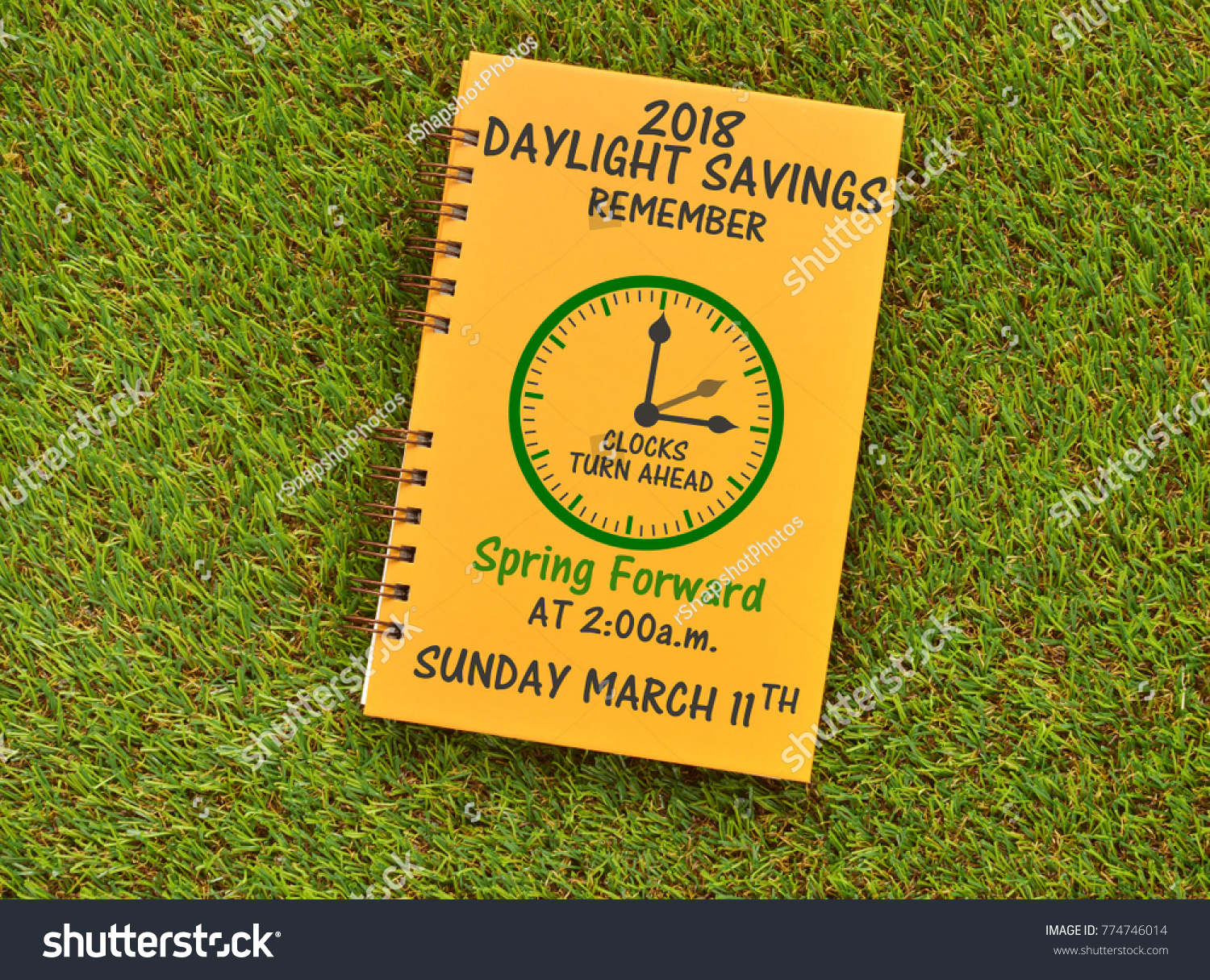 2018 Daylight Savings Remember clock turn ahead Spring Forward at 2:00 am Sunday March 11th on grass #774746014