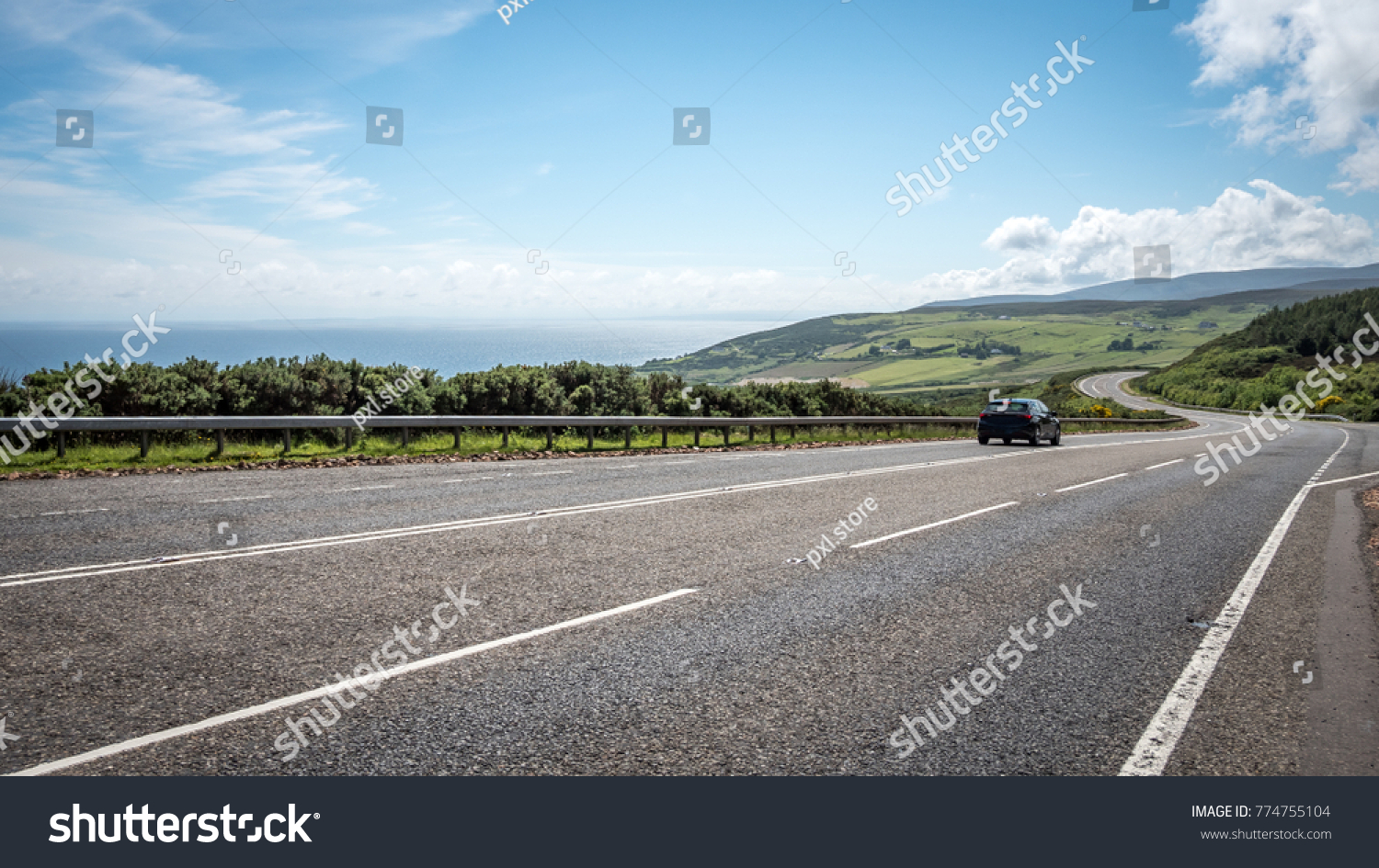 Scottish road trip. A view south along the arterial A9 road north of Helmsdale in the north east of Scotland. The road is one of the most northerly A roads on the British mainland. #774755104