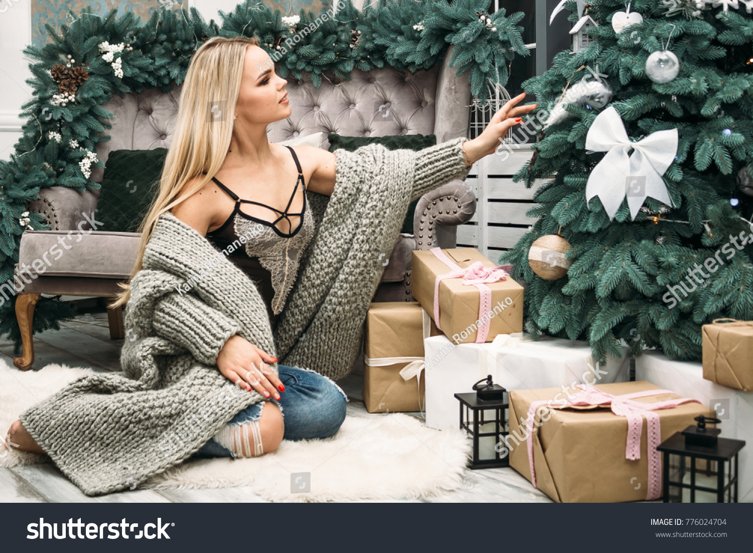 christmas. new year 2018. girl in christmas. girl in lingerie and sweater. a girl in a knitted sweater. girl in a gray sweater #776024704