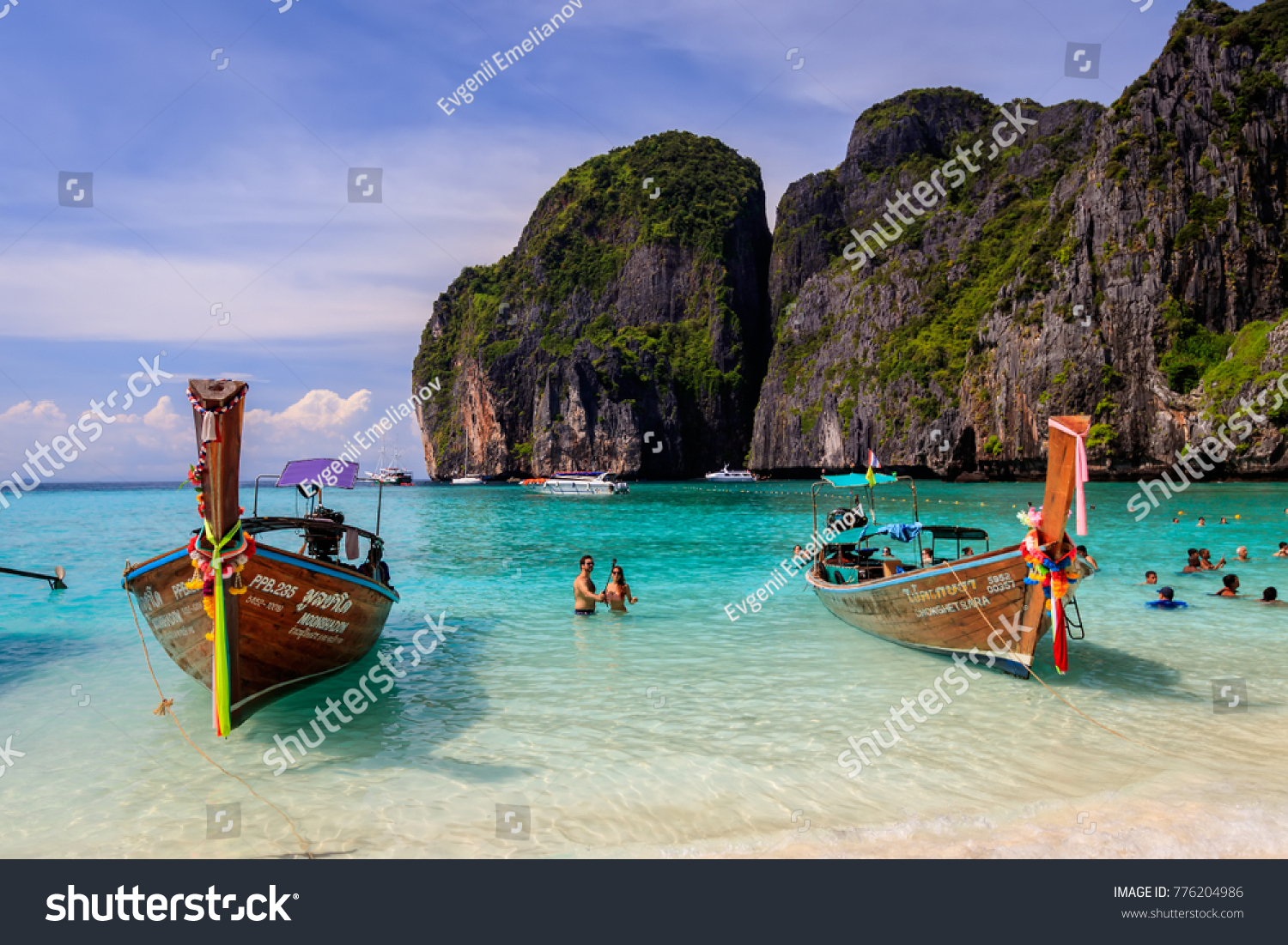 Maya Bay, Thailand, Krabi  - November 20, 2017: island of Phi Phi in a summer sunny day with karst rocks, boats, people and turquoise sea. Landscape.  #776204986