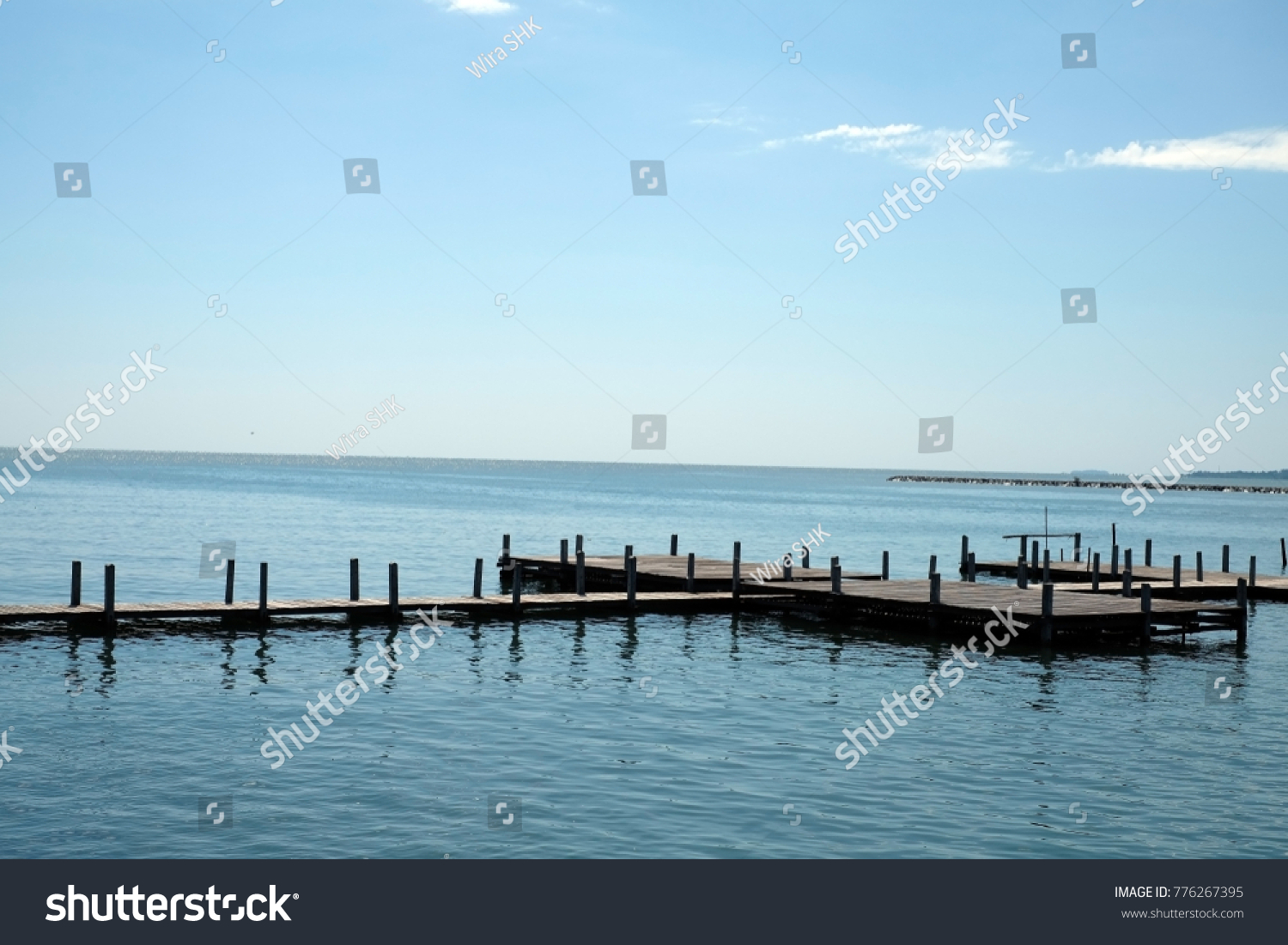 Wood pier, Close up wood pier with blue sky and white clouds image use for sea and transportation background #776267395