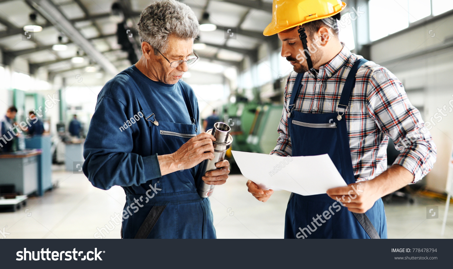 Supplier with engineer checking on production in factory #778478794