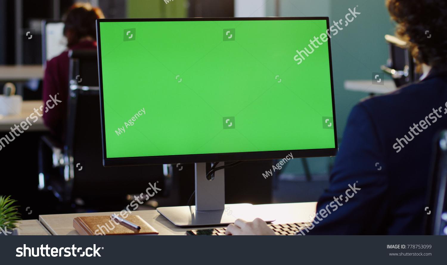 Businessman working on the PC computer and typing on the keyboard in the office. Rear view. Computer green screen, chroma key. Indoor #778753099