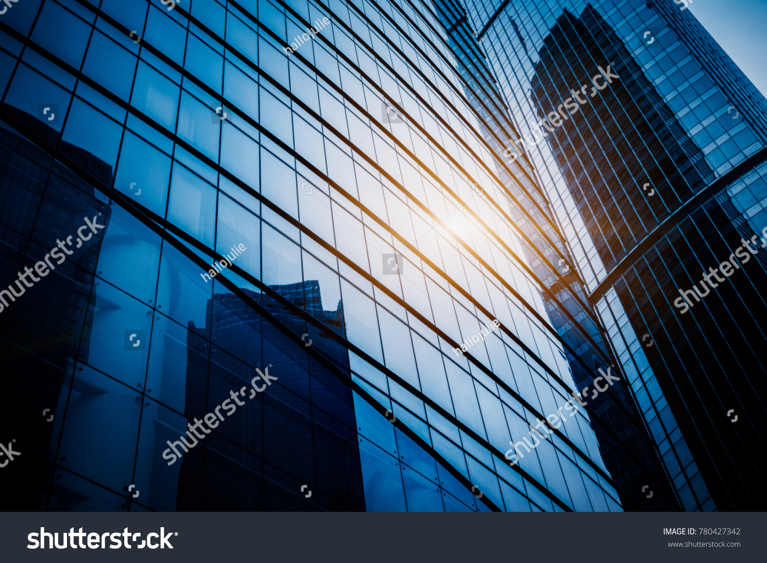 Modern office building against blue sky
 #780427342