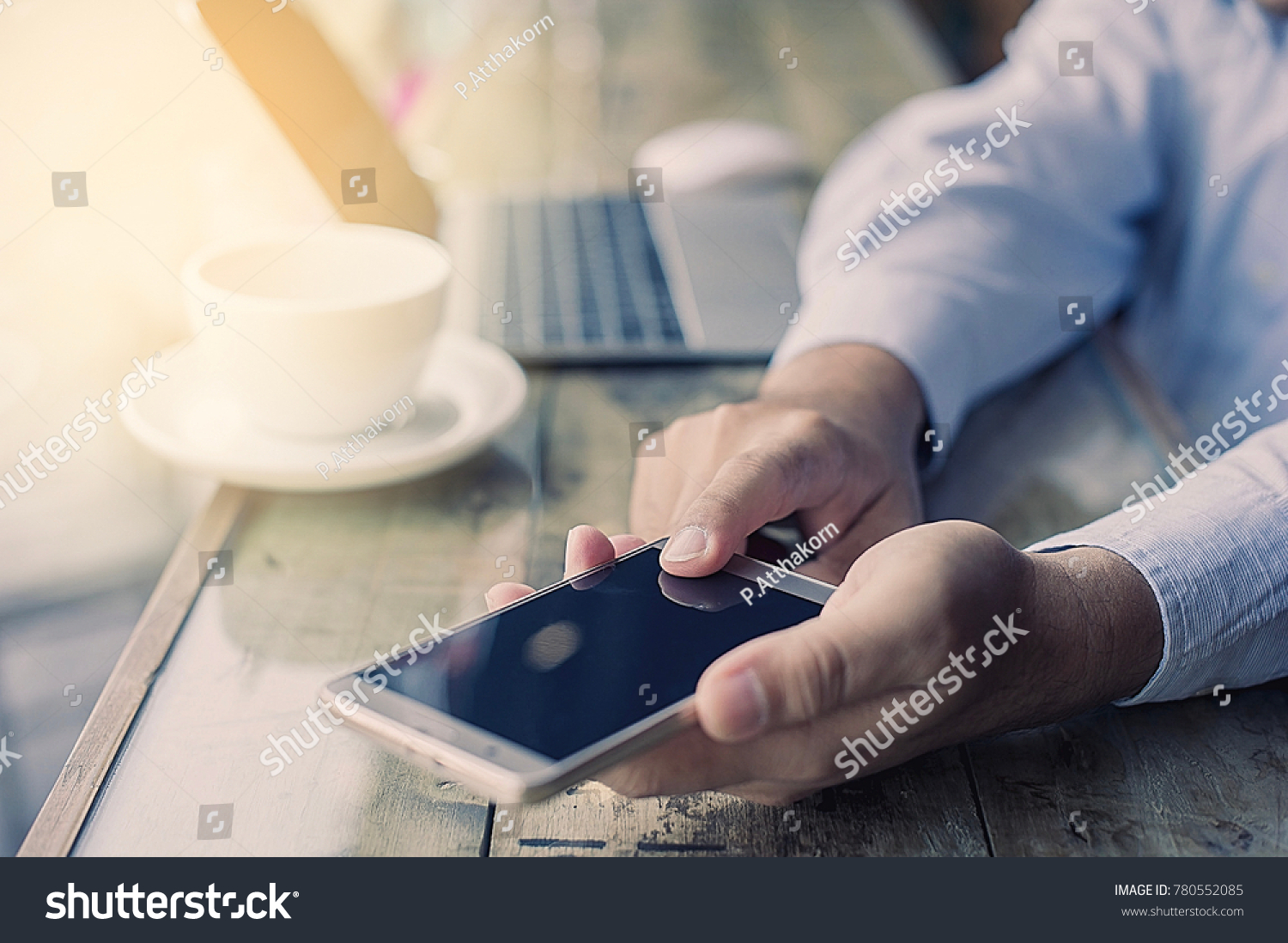 Businessman working with modern mobile phone #780552085