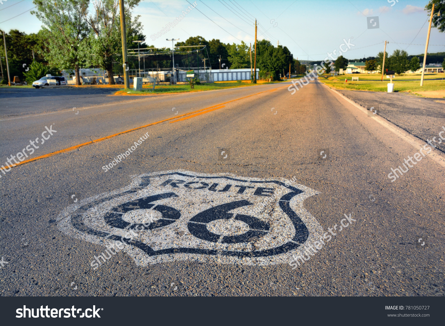 U.S. Route 66 highway, with sign on asphalt on Missouri.  #781050727