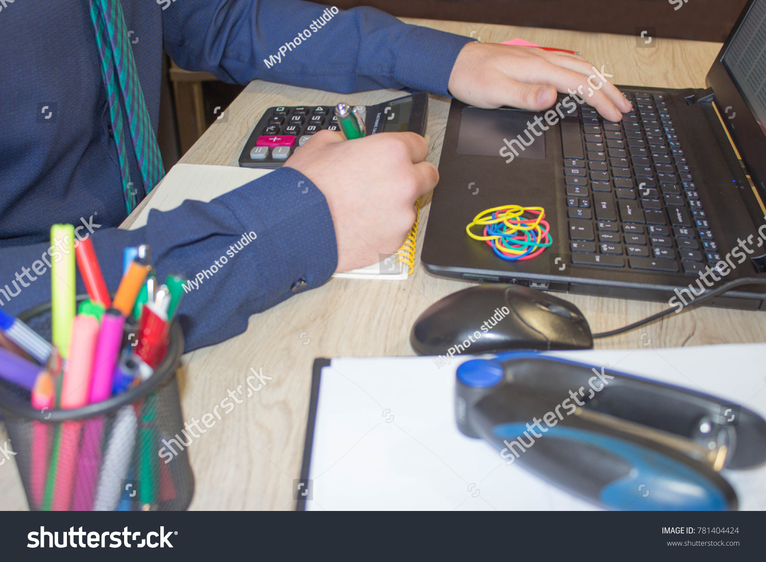 Businessman using a calculator to calculate the numbers. Businessman calculate finance and thinking about problem in home office. business male hands in office #781404424