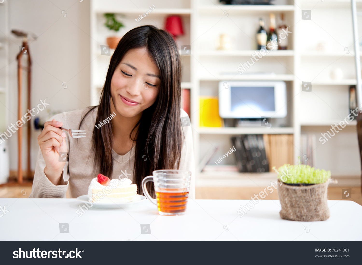 beautiful asian woman with tea and cake #78241381