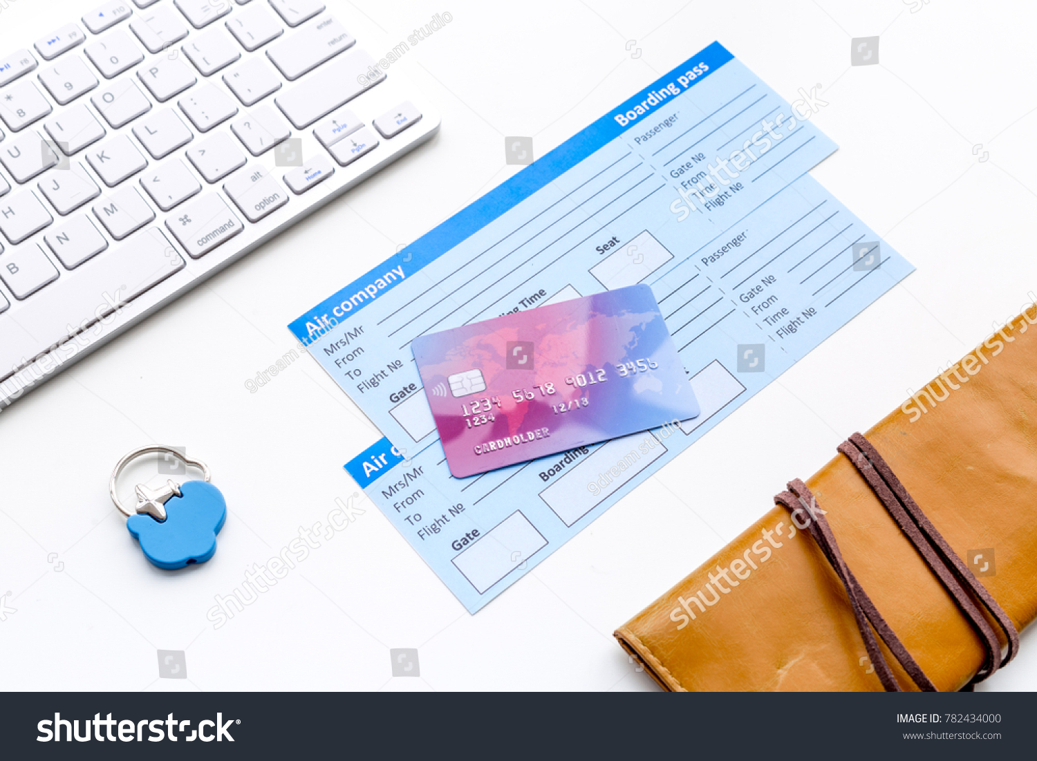 Book airplane ticket online. Documents near bank card, wallet and keyboard on white background top view #782434000