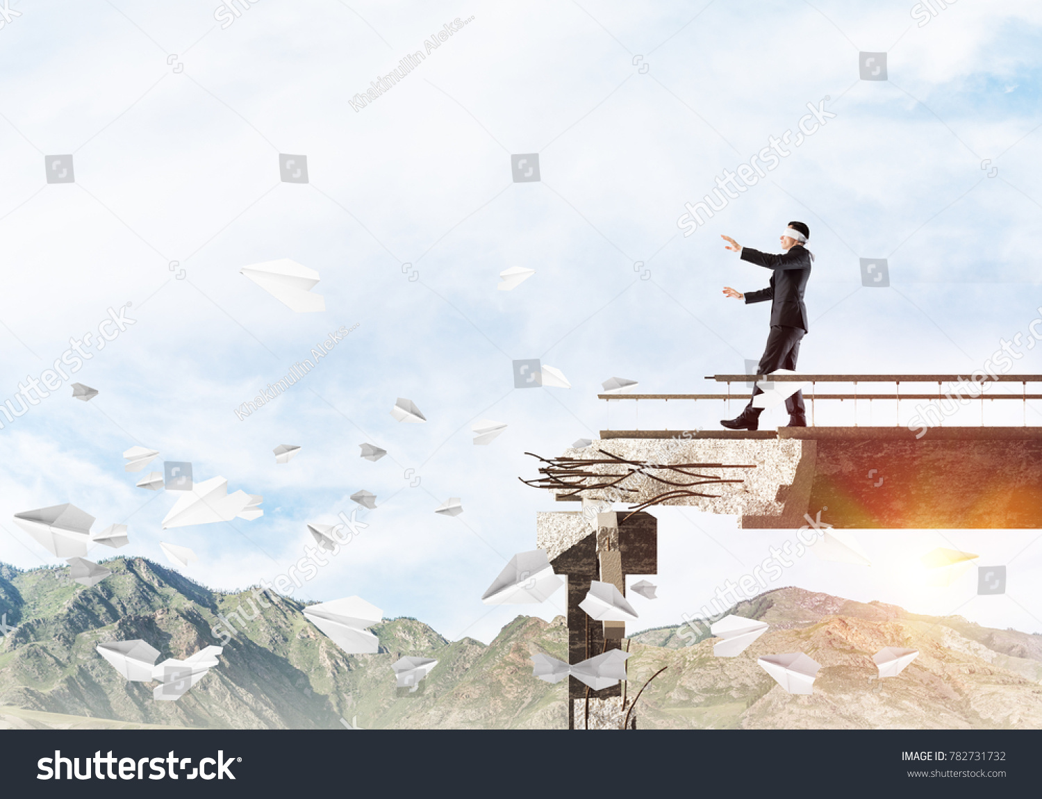 Businessman walking blindfolded on concrete bridge with huge gap as symbol of hidden threats and risks. Skyscape and nature view on background. 3D rendering. #782731732