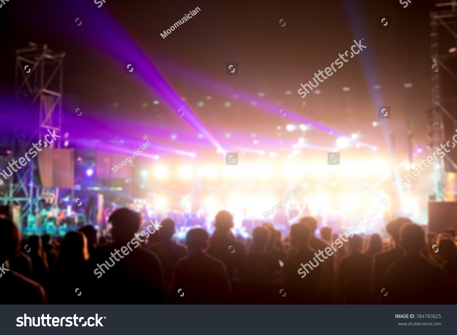 Blurred background : Bokeh lighting in outdoor concert with cheering audience #784783825