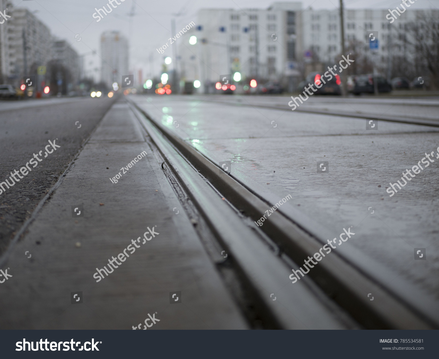 empty tram rails in the background of the city #785534581