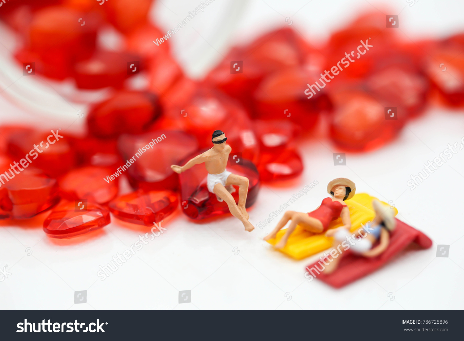 miniature people : wearing swimsuit relaxing with red heart,lover concept #786725896