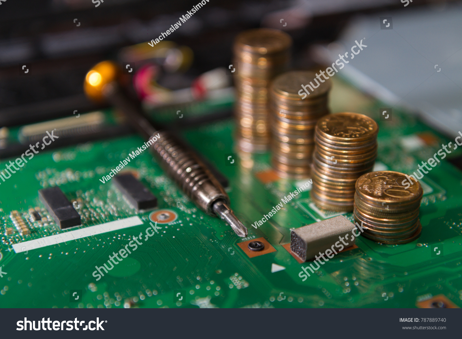 circuit board green with tools and coins closeup. business concept component repair laptop screwdriver #787889740