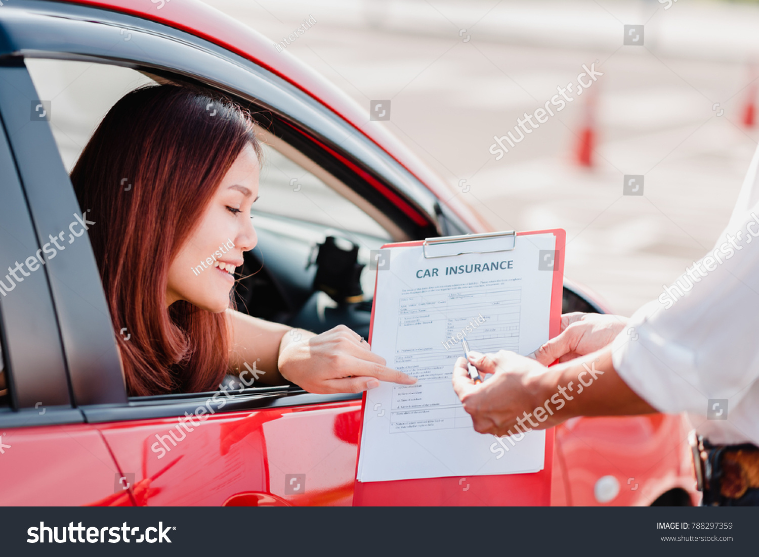 Insurance agent hand over car insurance document to asian woman client in car #788297359