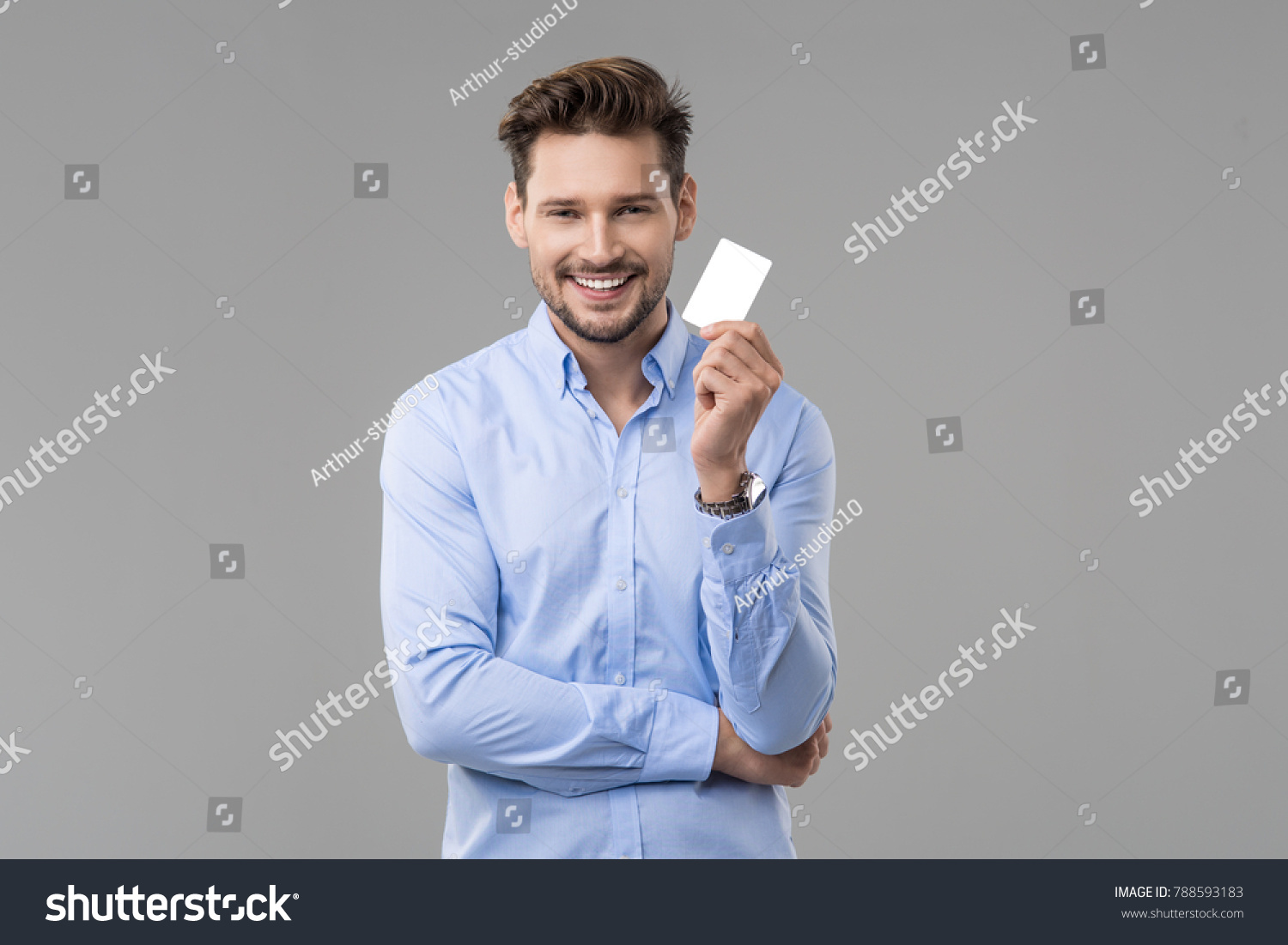 Handsome man in blue shirt  with white card #788593183