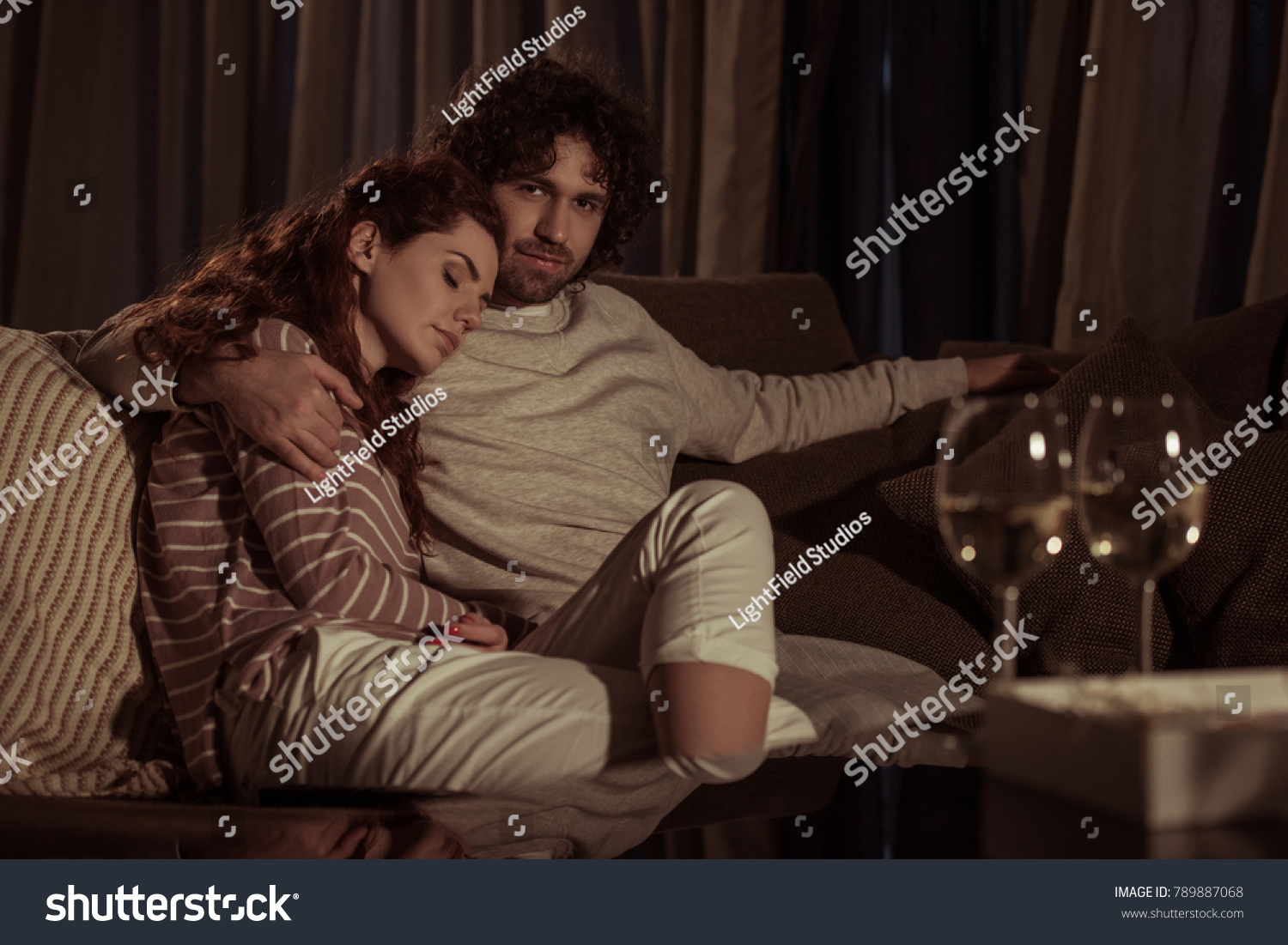 girlfriend sleeping on boyfriend shoulder in evening #789887068