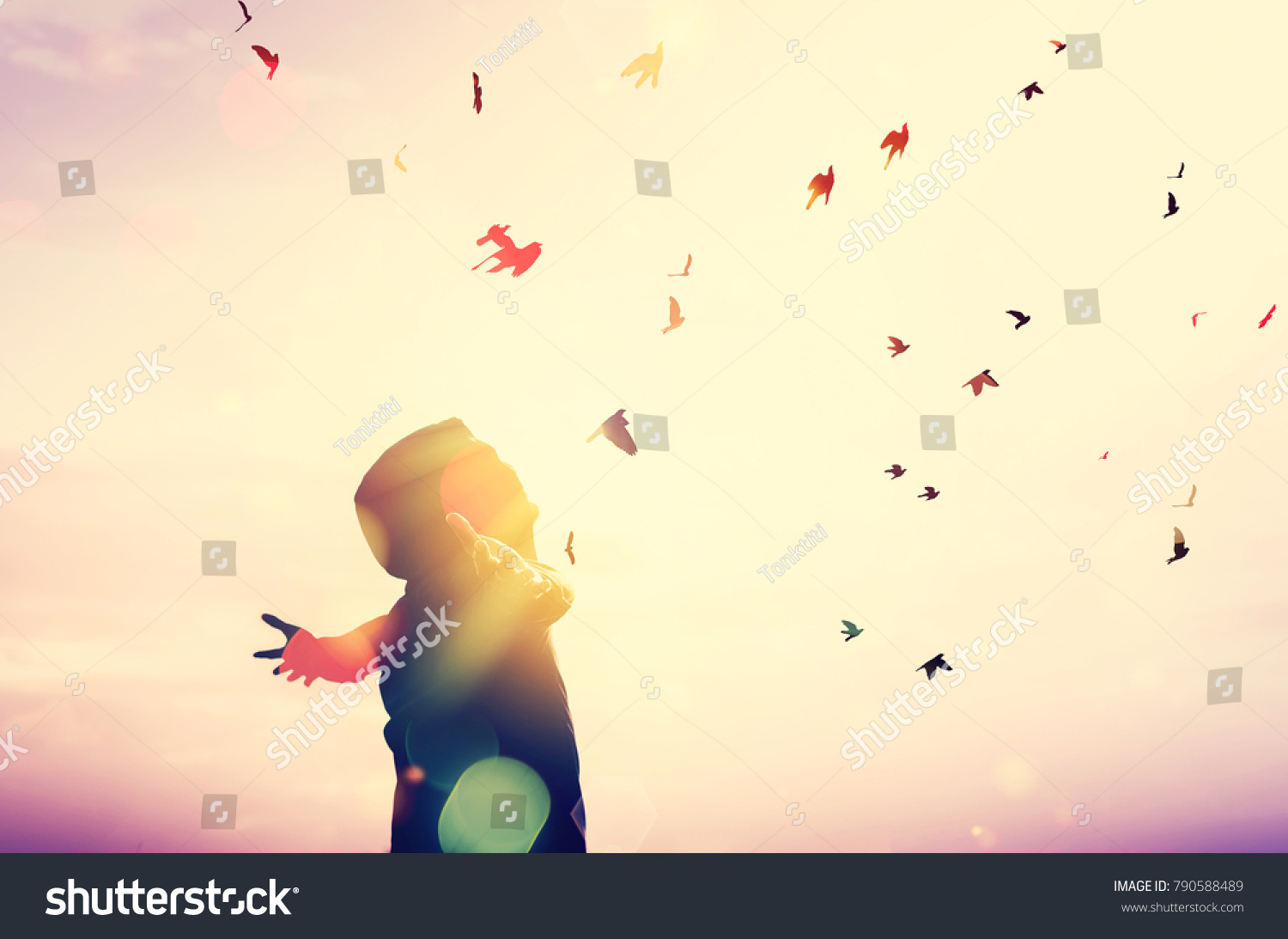 Freedom feel good and travel adventure concept. Copy space of silhouette man rising hands on sunset sky double exposure colorful bokeh and bird fly background. Vintage tone filter effect color style. #790588489