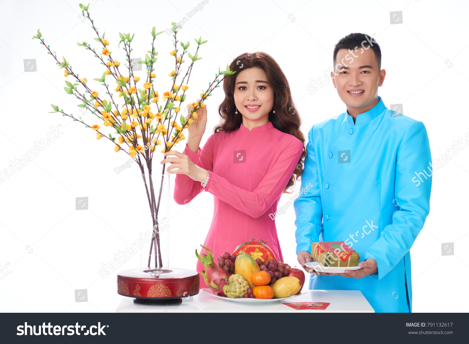 Cheerful Asian couple at table served for Tet celebration #791132617