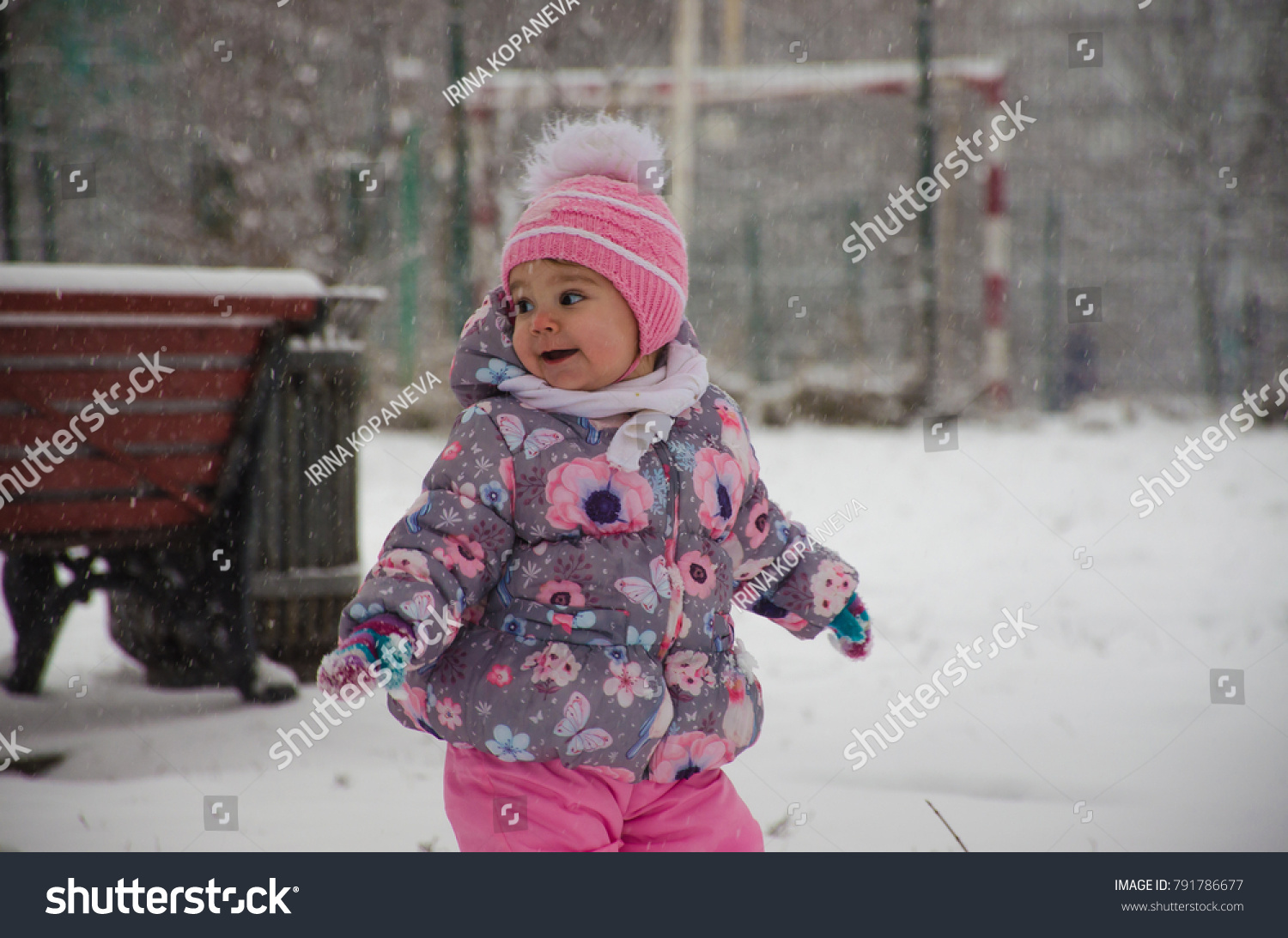 A child walks in the Park in the winter #791786677
