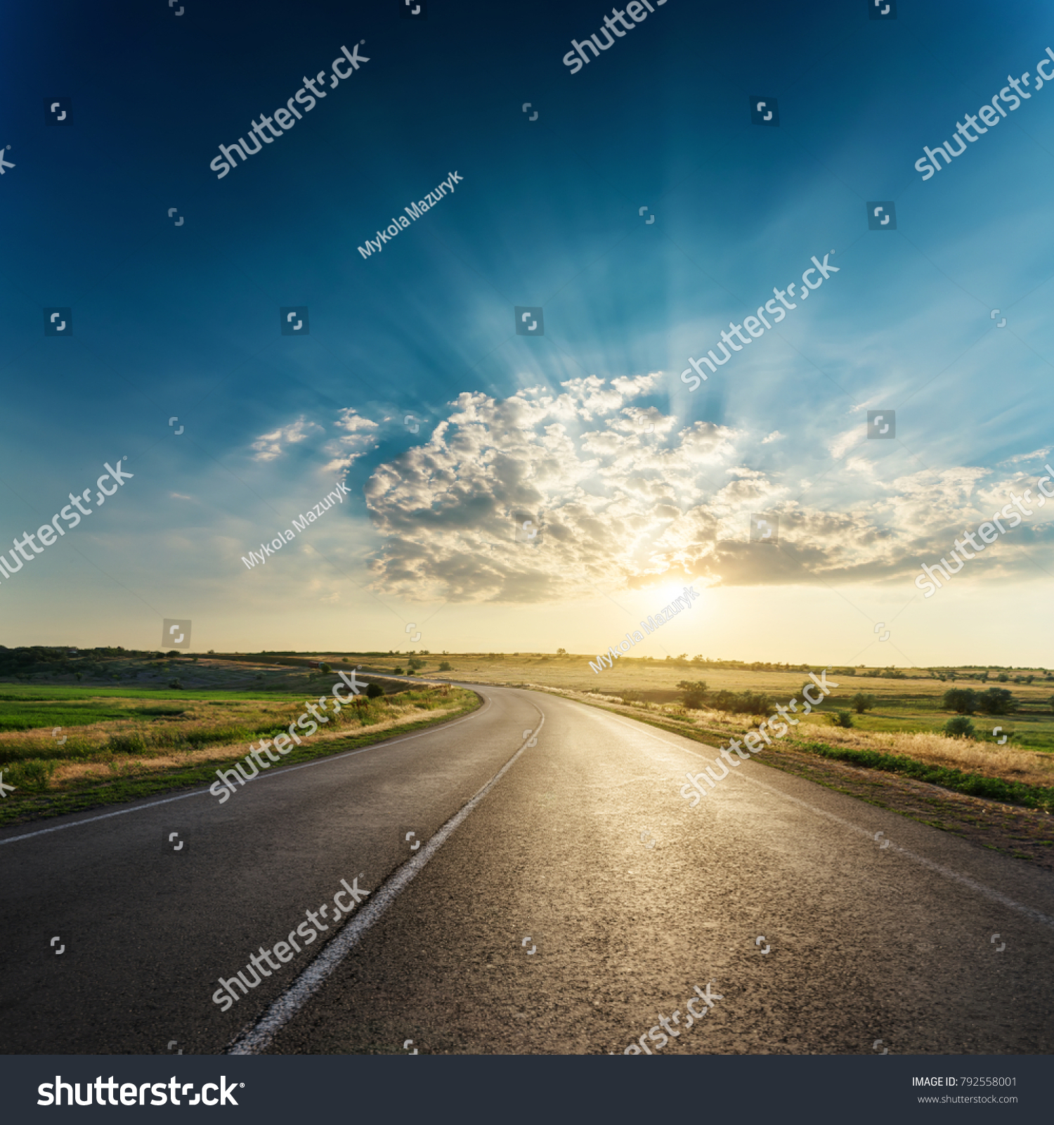 asphalt road in sunset #792558001