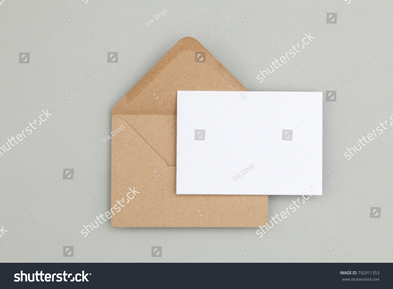 Blank white card with kraft brown paper envelope template mock up #792911353